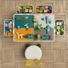 A top-down view of a children's building block table with storage containers and a chair. Anteprima dell’immagine prodotto