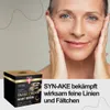 A woman is holding her face, with a product box in the foreground and marketing text on the right. Anteprima dell’immagine prodotto