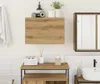 A bathroom vanity with a wall-mounted cabinet and sink. Anteprima dell’immagine prodotto