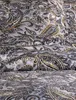 A close-up view of a fabric with a paisley pattern. Produktbild-Vorschau