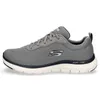 A side view of a single gray athletic shoe with navy accents and a white sole. Produktbild-Vorschau