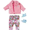 A set of doll clothes and shoes laid out on a white background. Produktbild-Vorschau