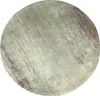 A round rug with a distressed, abstract pattern. Produktbild-Vorschau