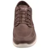 A close-up, front-facing view of a brown Skechers slip-on boot. Náhled obrázku produktu