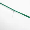 A close-up view of a zipper on a white fabric with a green trim. Produktbild-Vorschau