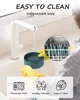 A person wearing yellow gloves is washing a teal pet bowl under a white faucet in a sink. A close-up inset shows the bowl inside a dishwasher. Produktbild-Vorschau