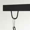 A close-up view of a black hook attached to a black bar, with a silver carabiner clip hanging from the hook. Podgląd zdjęcia produktu