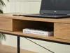 Close-up of a wooden desk with a laptop and a book. Podgląd zdjęcia produktu