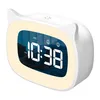 A white digital alarm clock with a cat-ear design and a glowing yellow light ring around the display. Produktbild-Vorschau