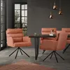 A dining room scene with orange chairs around a dark wood table. Produktbild-Vorschau
