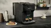 A black Siemens coffee machine is shown on a kitchen counter with two cups of espresso and two eclairs. Produktbild-Vorschau