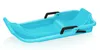 A blue plastic sled with black handles against a white background. Anteprima dell’immagine prodotto