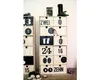 A collection of wooden advent calendar drawers stacked vertically, decorated with numbers and words. Some drawers are open, revealing small items or decorations. The calendar is placed on a wooden surface, with some cookies and pine branches around it. Náhľad obrázku produktu