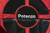 A close-up of a red and black circular object with the word 'Potenza' in white text in the center. Produktbild-Vorschau