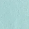 A close-up view of a mint-colored fabric with a visible knit texture. Náhľad obrázku produktu