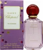A perfume bottle and its packaging are displayed side-by-side against a white background. Voir les images du produit