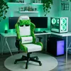 A gaming chair and computer setup in a room with green ambient lighting. Náhľad obrázku produktu