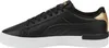 Side view of a black Puma sneaker with gold accents. Podgląd zdjęcia produktu