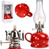 A collage of images showing a red and white polka dot oil lamp from different angles, including its packaging. Náhled obrázku produktu
