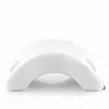 A white orthopedic pillow with a curved shape and textured fabric, presented on a white background. Náhľad obrázku produktu