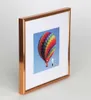 A framed picture of a hot air balloon. Produktbild-Vorschau