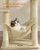 A cat is relaxing in a hammock attached to a cat tree. Produktbild-Vorschau