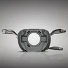 A steering wheel control module with multiple levers is shown against a gradient gray background. Produktbild-Vorschau
