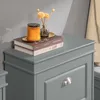 A close-up view of a gray cabinet with decorative items on top. Náhľad obrázku produktu