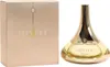 Guerlain Idylle Eau de Toilette 50 ml, eleganter goldfarbener Glasflakon mit geschwungener Form neben champagnerfarbener Originalverpackung. Produktbild-Vorschau