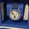 A blue Swatch x Omega watch is displayed inside its blue packaging, with accompanying booklets. Náhled obrázku produktu