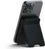 A black Satechi magnetic power bank with a stand function is attached to the back of a gray smartphone. Produktbild-Vorschau