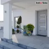 A modern house entrance with a gray door, potted plants, and a white pillar. Náhled obrázku produktu