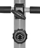 A close-up of a tension control knob and adjustment lever on a piece of fitness equipment. Produktbild-Vorschau