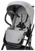 Close-up view of a gray stroller seat with black harness and handle. Produktbild-Vorschau