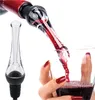 A hand holding a wine glass with red wine being poured into it through a wine aerator attached to a wine bottle. Produktbild-Vorschau