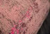 A close-up view of a textured fabric with an abstract pattern. Produktbild-Vorschau