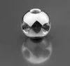 A shiny, spherical metal object with multiple threaded holes, sitting on a reflective gray surface. Produktbild-Vorschau