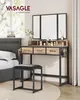 A vanity set with a tri-fold mirror and matching stool next to a bed. Náhľad obrázku produktu