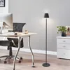 A modern office or study space with a desk, computer, chair, and a floor lamp. Produktbild-Vorschau