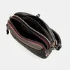 A top-down view of an open handbag against a plain background. Anteprima dell’immagine prodotto