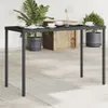 A black poly rattan garden table with a glass top is set up on a patio with potted plants and tableware. Produktbild-Vorschau