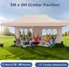 A group of people are sitting and standing under a large beige pavilion in a grassy field. Produktbild-Vorschau