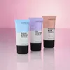 Three tubes of Catrice primer arranged diagonally on a pink and white gradient background. Voir les images du produit
