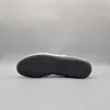 The sole of a Puma shoe is shown against a plain gray background. Voir les images du produit
