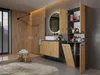 A modern bathroom with a wooden accent wall, a vanity with a sink, a mirror with integrated lighting, and a tall cabinet with open shelves and a laundry basket. Anteprima dell’immagine prodotto