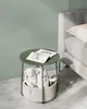 A small round side table with a basket and stuffed animals. Náhled obrázku produktu