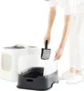 A person is cleaning a litter box with a scoop. Produktbild-Vorschau