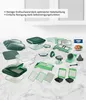 A collection of kitchen food preparation tools, including various cutting attachments, containers, and a grater, arranged on a marble-like surface. Anteprima dell’immagine prodotto