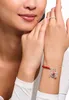 A woman's wrist and hand wearing a bracelet and ring. Produktbild-Vorschau
