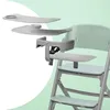 A high chair with accessories, presented in a clean, studio-like setting with a light green gradient background. Podgląd zdjęcia produktu